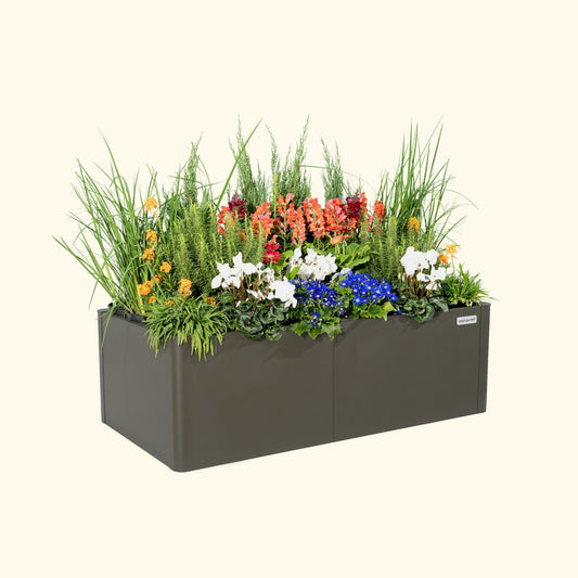 Urban Charcoal tall modern raised garden bed with colorful flowers and plants on a white background.