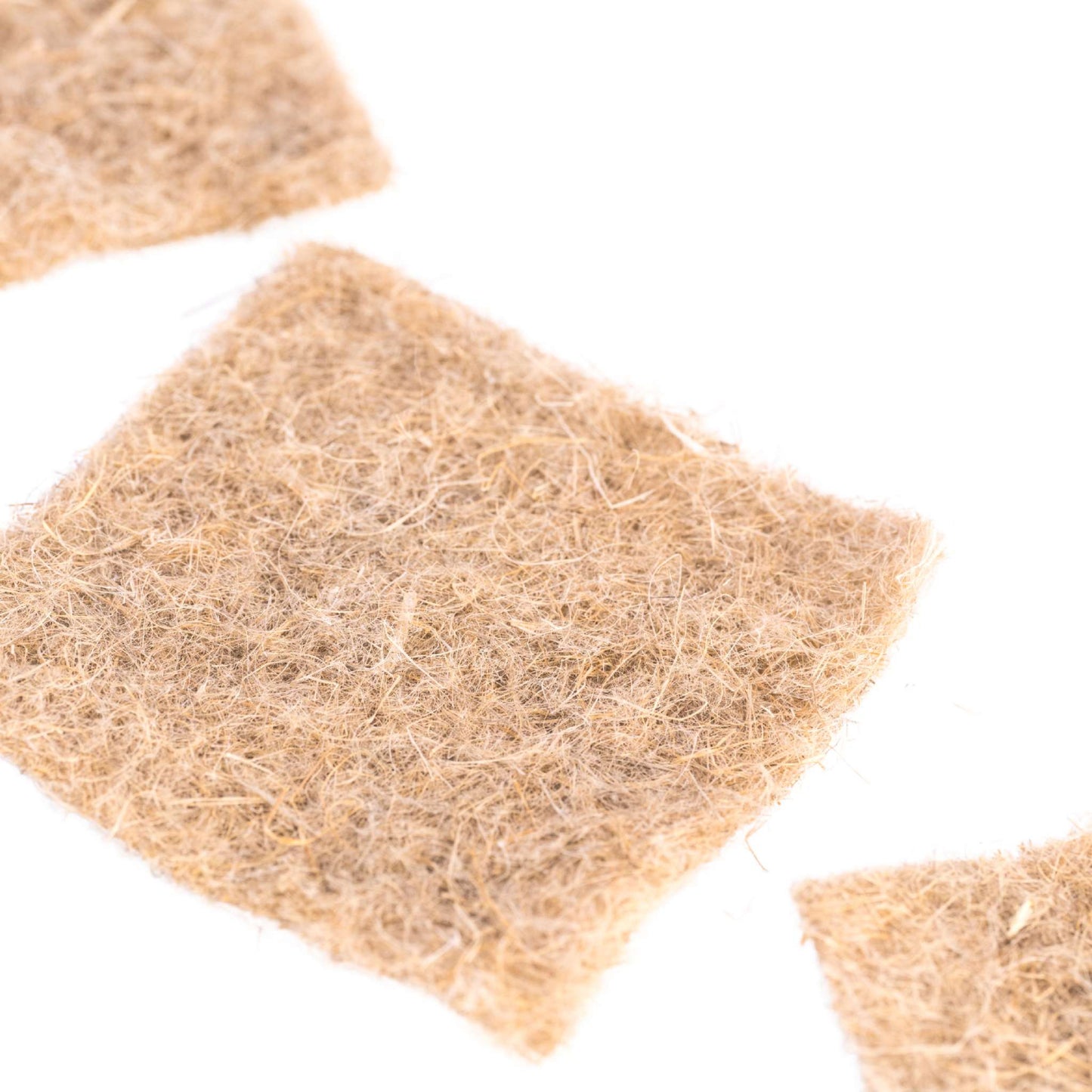 Close-up of three 5-inch hemp grow mats showing fibrous texture, used as a soilless growing medium on white background