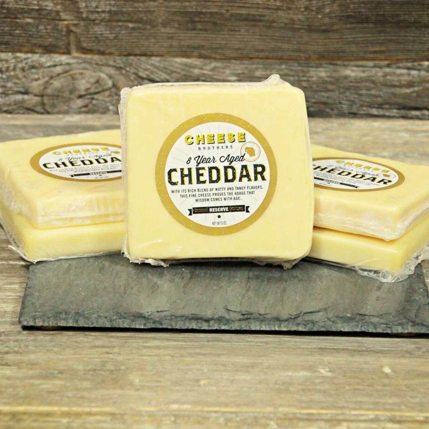 8 Year Aged Cheddar- 8 Year Aged Cheddar blocks with rustic background