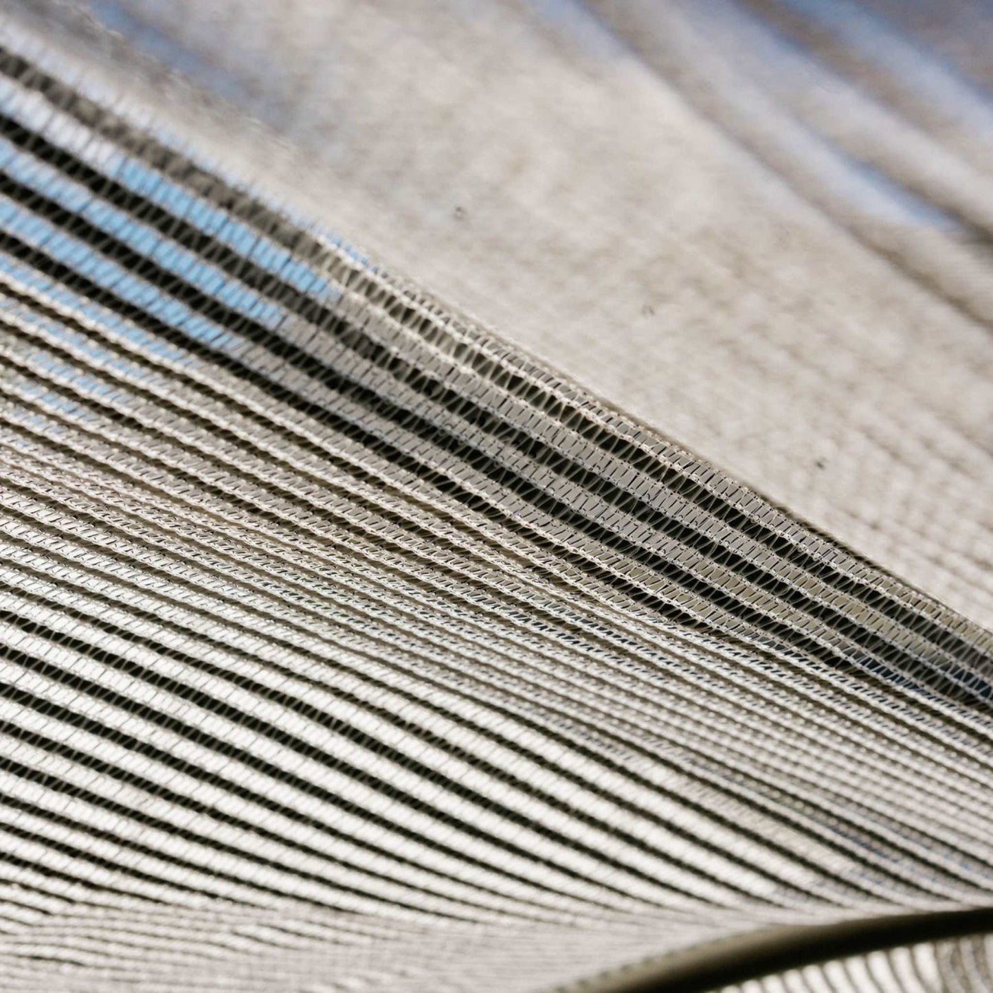 close up of underside of white shade cloths material