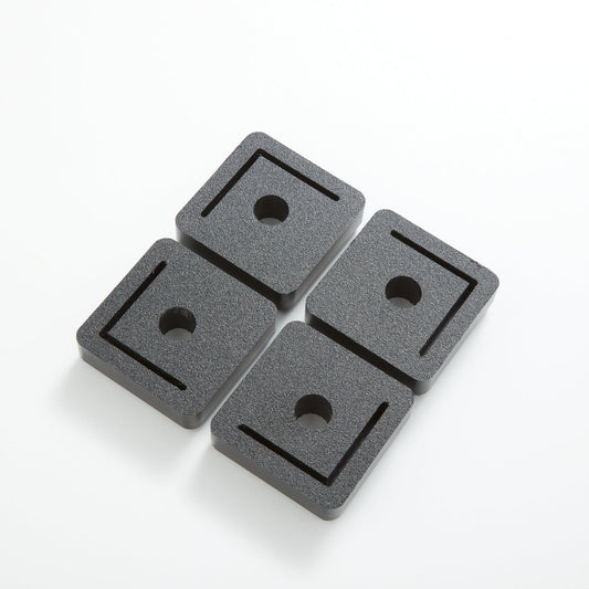 Four gray platform feet on a white background