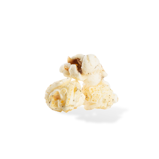 Three pieces of Sea Salt and Cracked Pepper popcorn on a white background