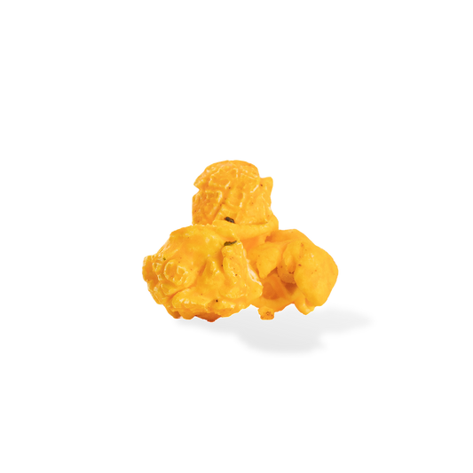 Three pieces of Spicy Buffalo popcorn on a white background