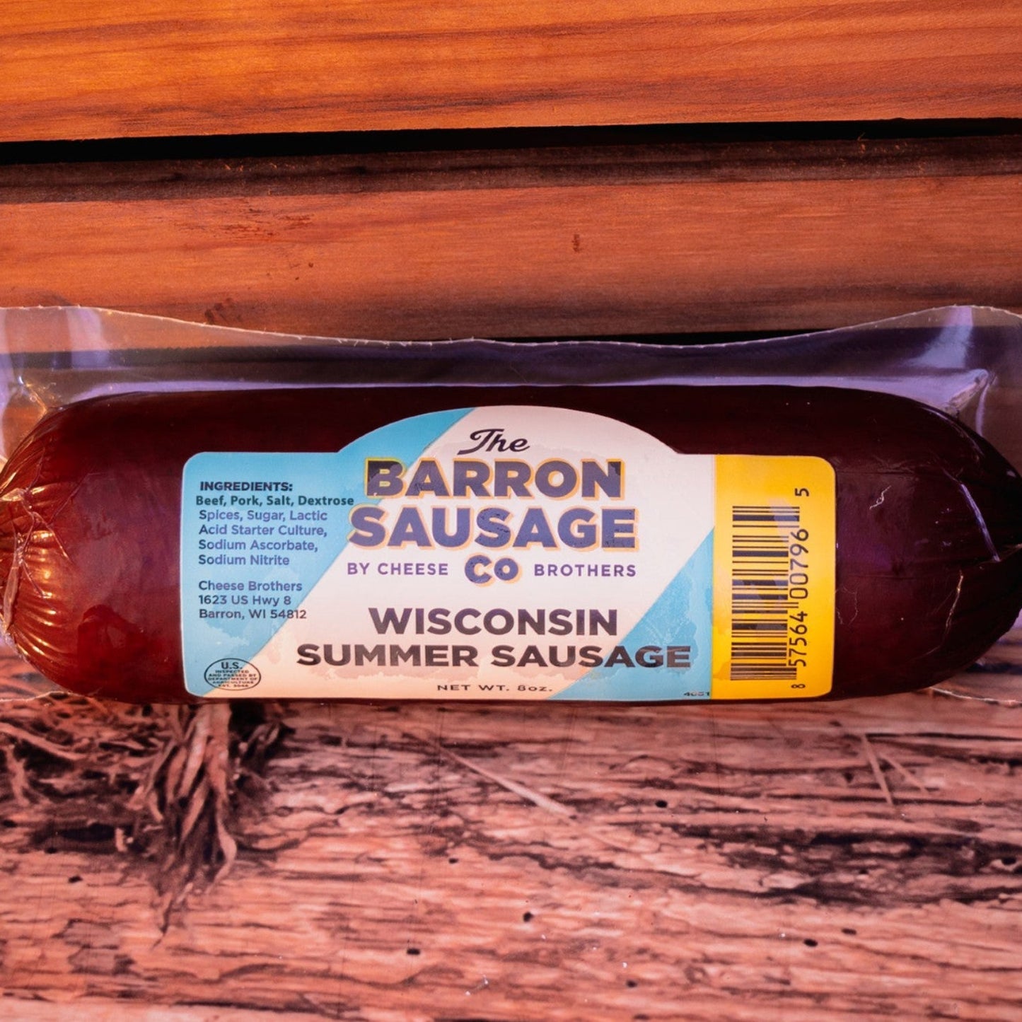 Packaged summer sausage on a wooden surface