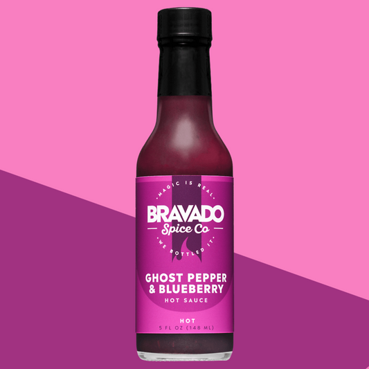 Ghost Pepper & Blueberry hot sauce on a pink and purple gradient background
