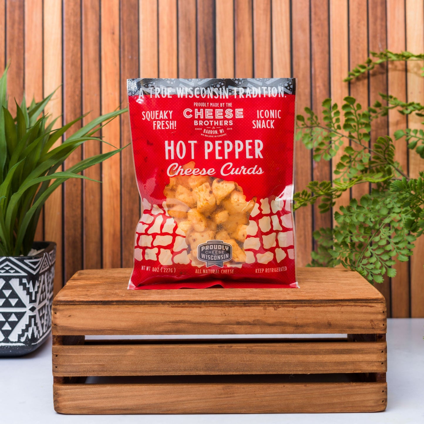 bag of hot pepper wisconsin cheese curds on wooden box