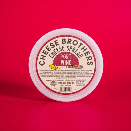container of cheese brothers port wine cheese spread on red background