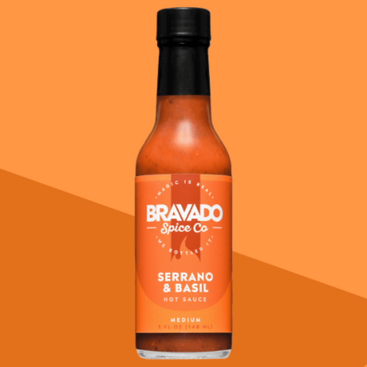 Serrano & Basil hot sauce bottle on an orange background