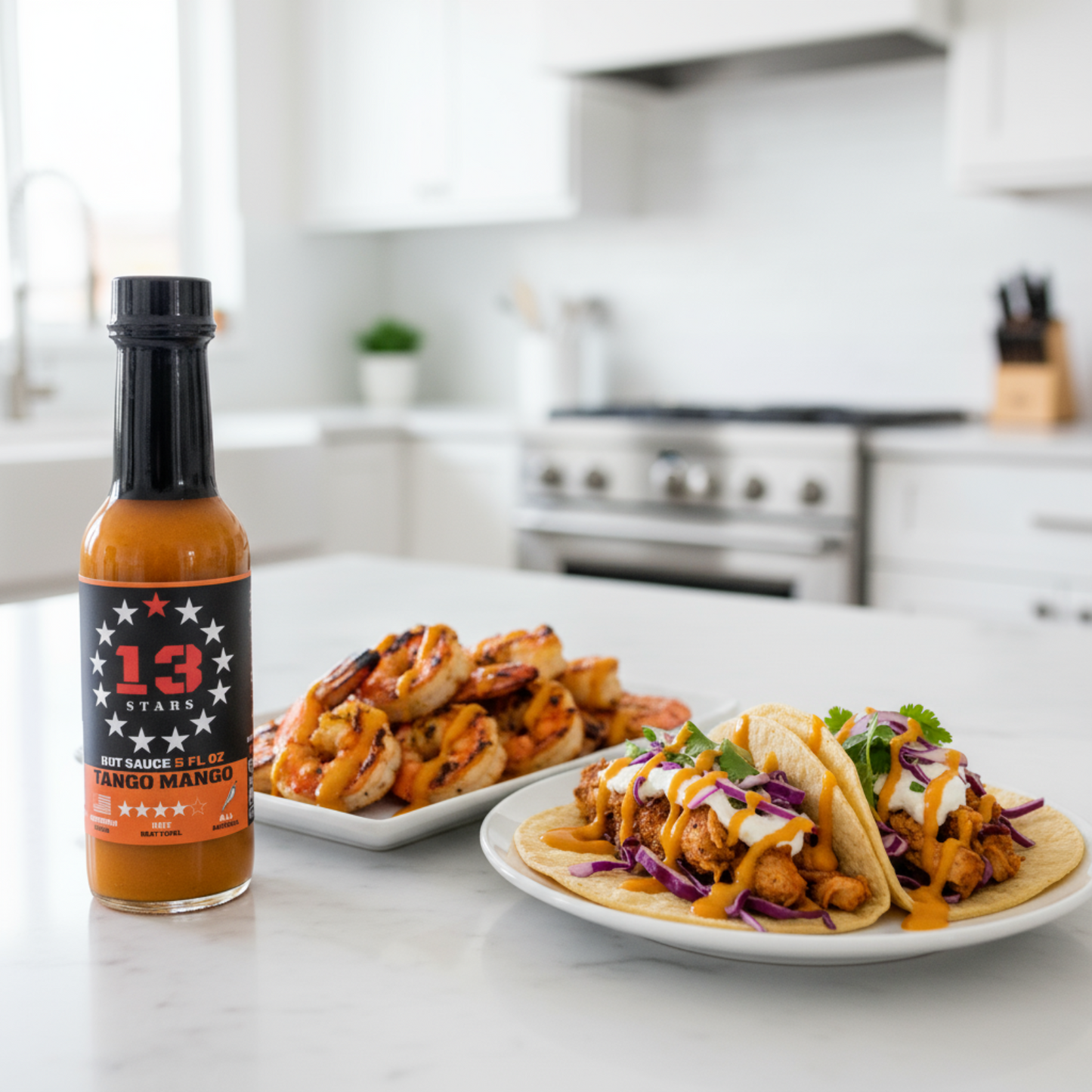 Tango Mango Hot Sauce bottle on a white kitchen counter beside a plate of grilled shrimp and a plate of tacos drizzled with spicy hot sauce.