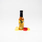 Pepper Joe's Carolina Reaper Hottest Hot Sauce gift set - Pineapple Reaper hot sauce bottle with pineapple chunks around