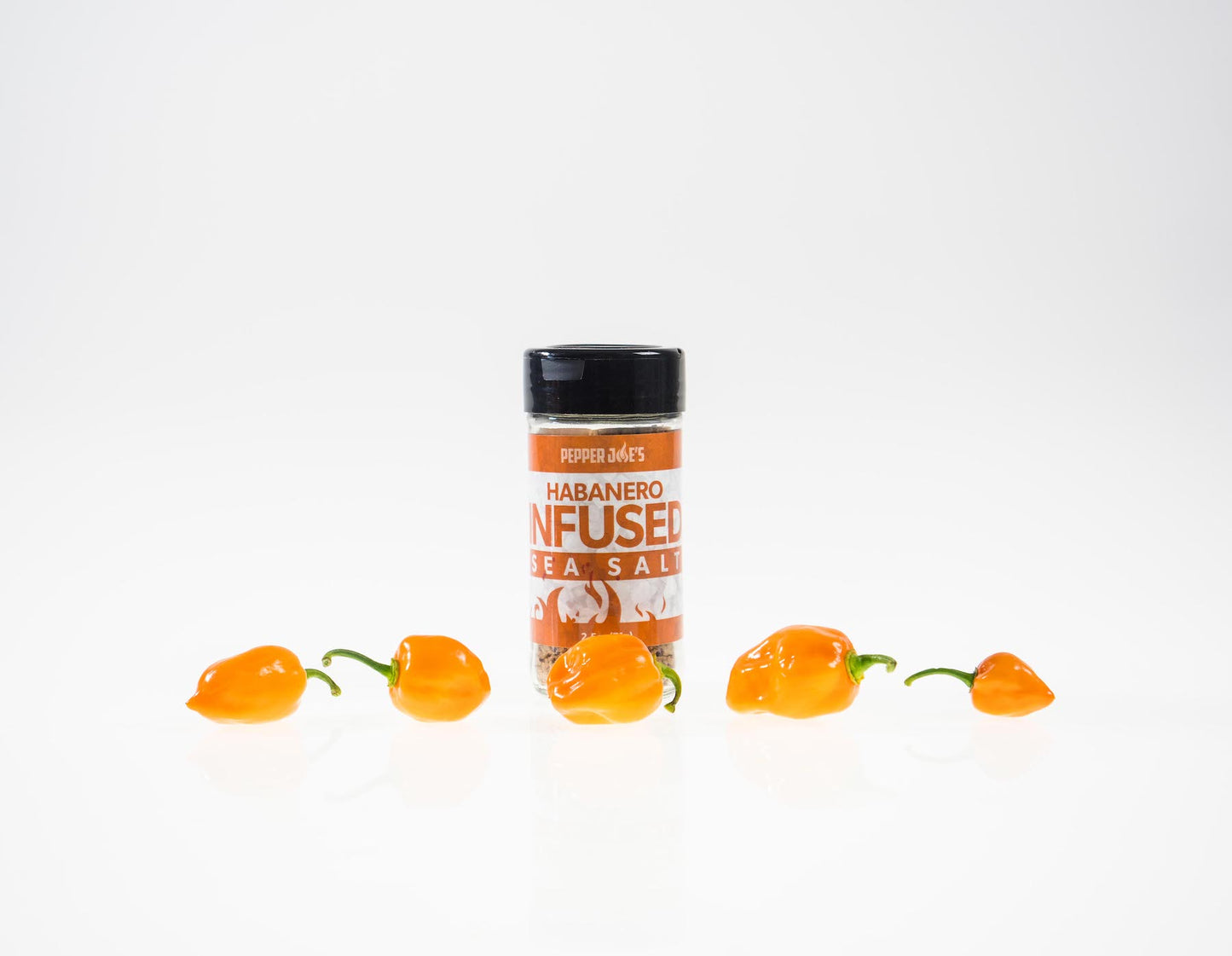 Pepper Joe's Habanero Sea Salt - spicy sea salt with yellow habaneros on white background