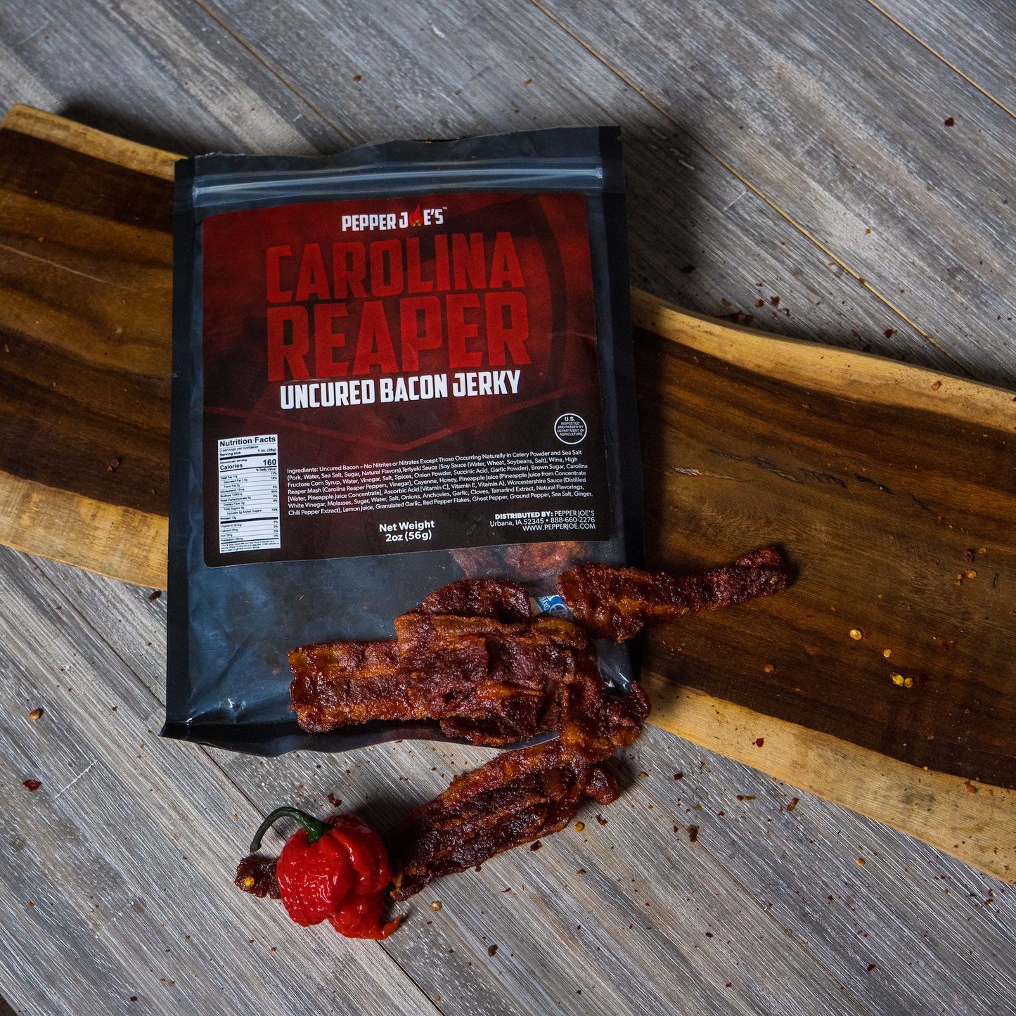 Carolina Reaper Bacon Jerky bag on charcuterie board 