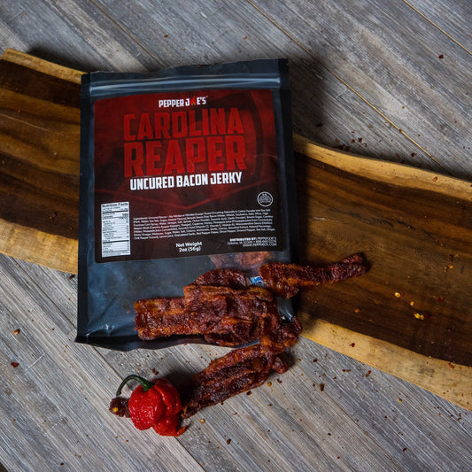Carolina Reaper Bacon Jerky bag on charcuterie board