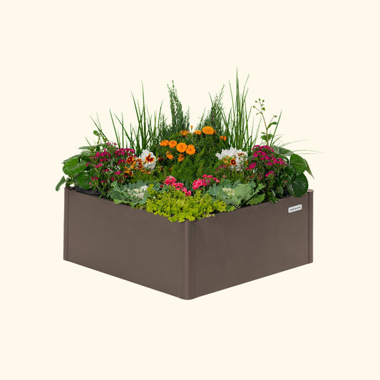 Umber Brown tall modern square raised garden bed with colorful flowers and plants on a white background.