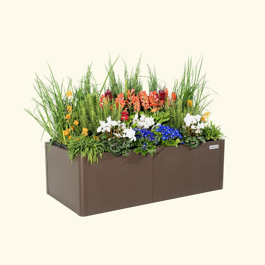Umber Brown tall modern raised garden bed with colorful flowers and plants on a white background.