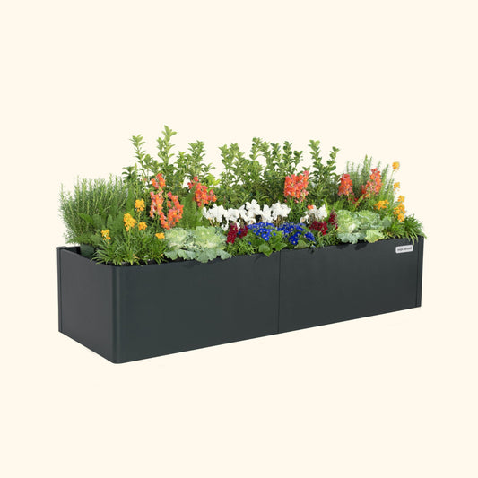 Midnight Blue 17 inch tall modern raised garden bed with colorful flowers and plants on a white background.