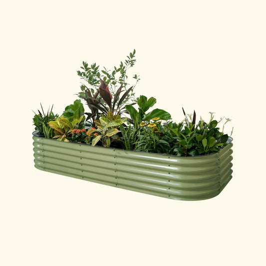 An olive green modular metal raised garden bed kit filled with various plants and vegetables.