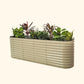 A pearl white extra tall 9 in one Modular Metal Raised Garden Bed metal raised garden bed with colorful flowers and plants on a white background.