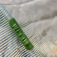 close up of white shade cloth with shade cloth clip in use