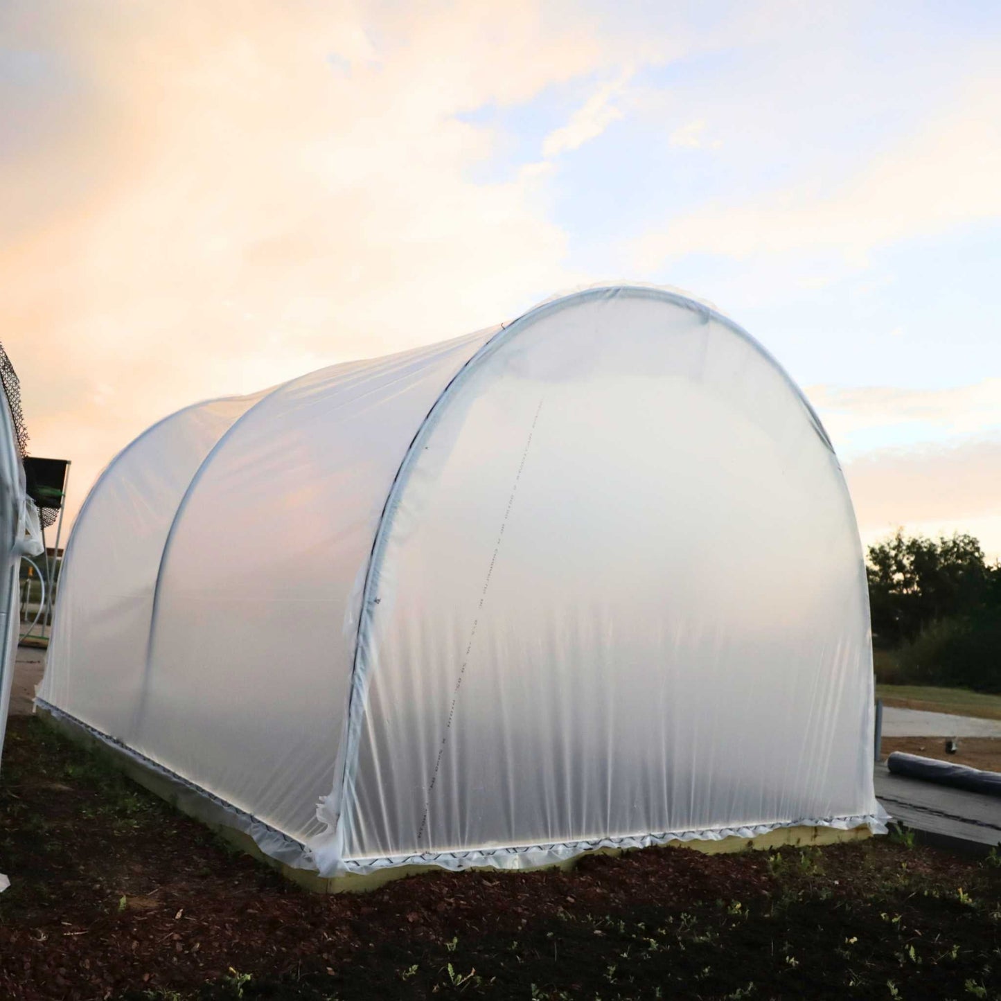 Backview of Hobby Greenhouse in a Backyard Setting.
