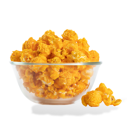 Bacon Cheddar Popcorn popped in a bowl on a white background