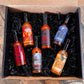 Six assorted Pepper Joe's hot sauces displayed for Build Your Own 6-Pack bundle