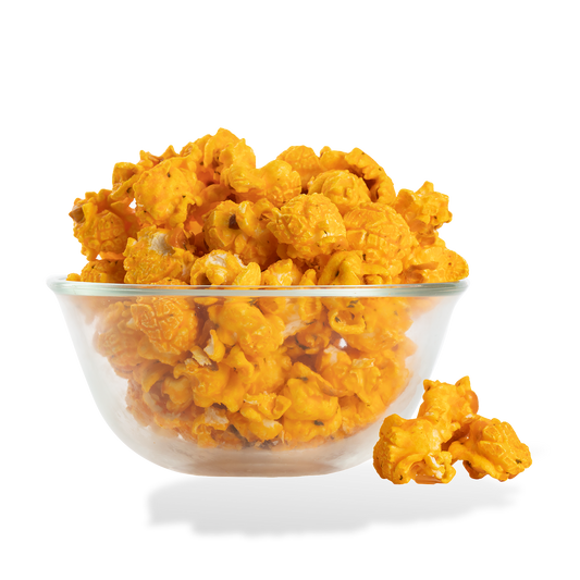 Cheesy Ranch Popcorn popped in a bowl on a white background