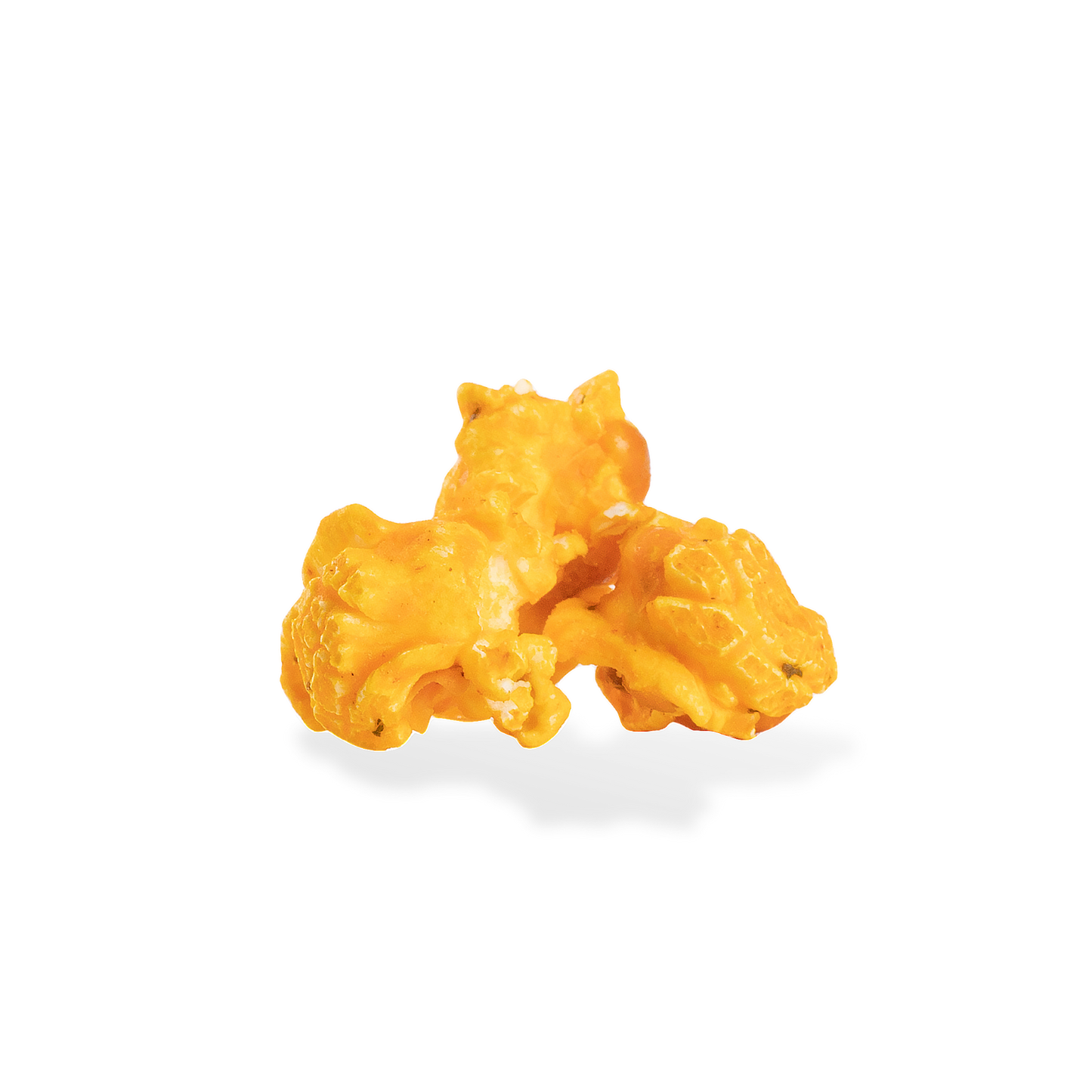 Three pieces of Cheesy Ranch popcorn on a white background