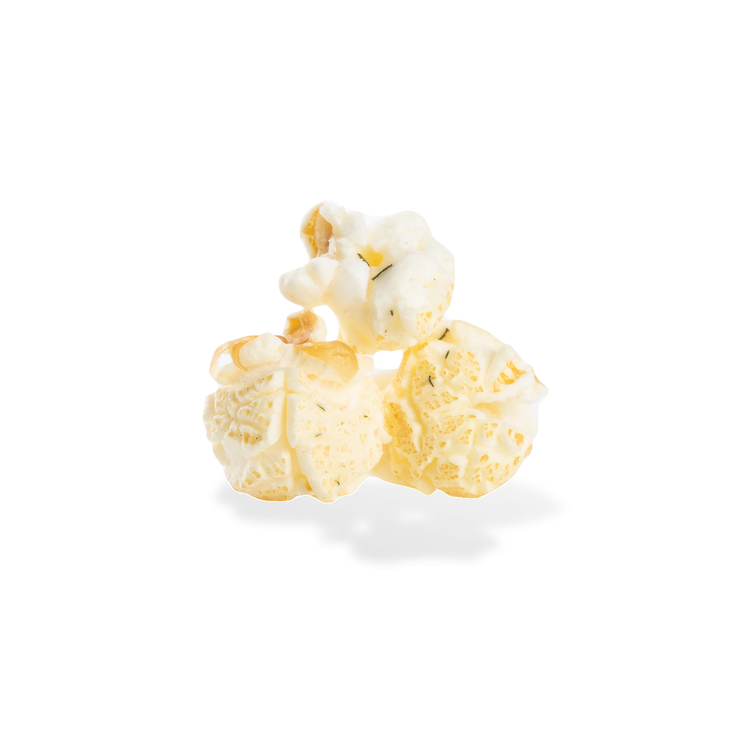 Three pieces of Dill Pickle popcorn on a white background