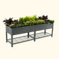 Modern Gray elevated metal garden bed with plants on a white background