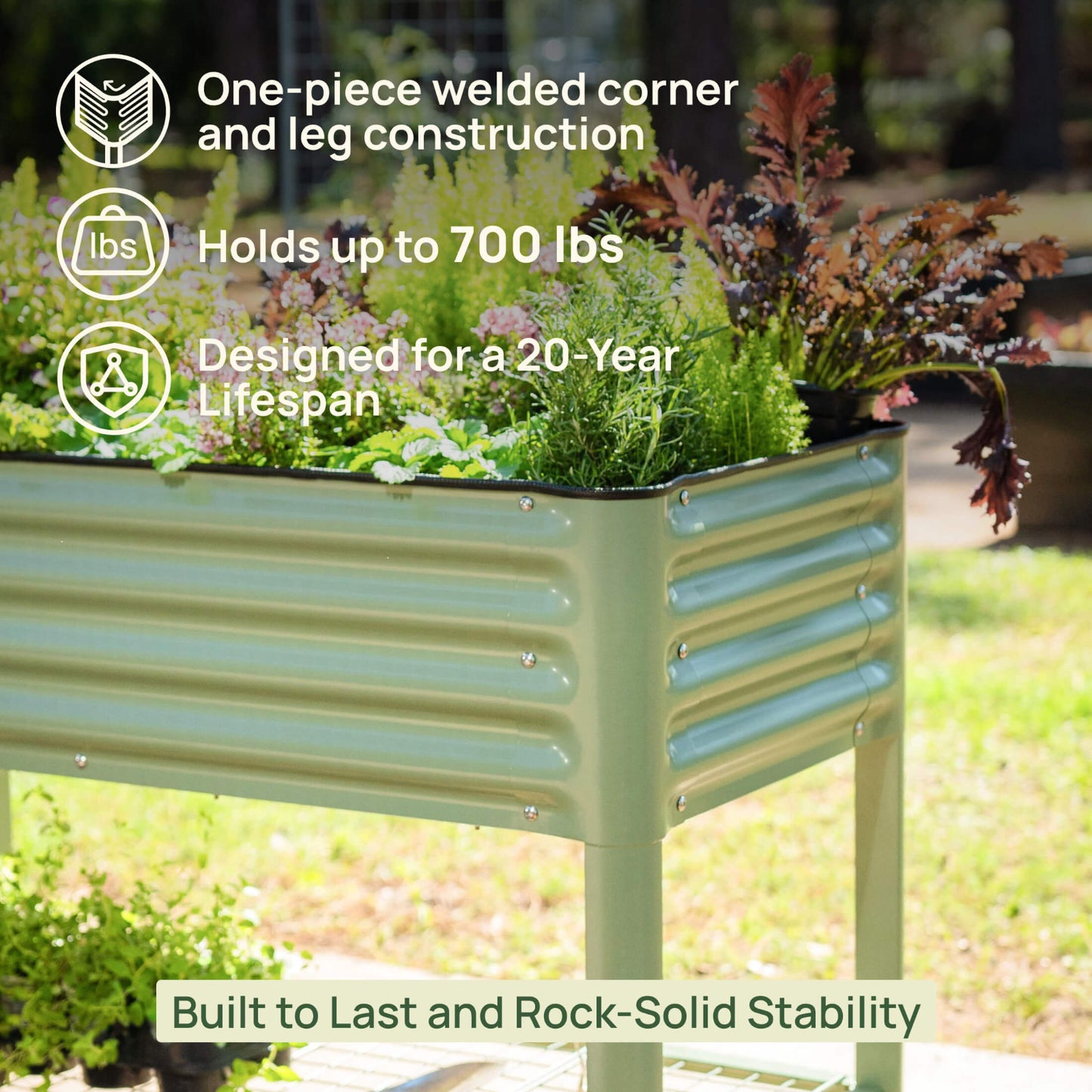 Green metal raised garden bed with plants, text highlighting stability features, and blurred outdoor background.

Features include: one-piece welded corner and leg construction, holds up to 700 pounds, and designed for a 20-year lifespan.