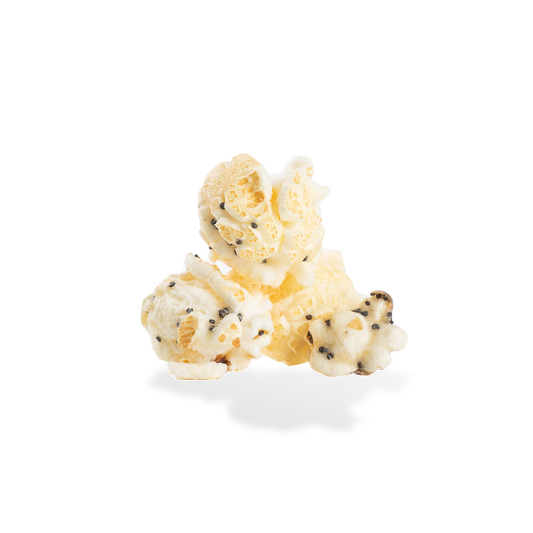 Three pieces of Everything Bagel popcorn on a white background