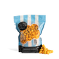 Bag of City Pop Extra Buttery Caramel Cheese Mix popcorn with blue and white striped design on a white background