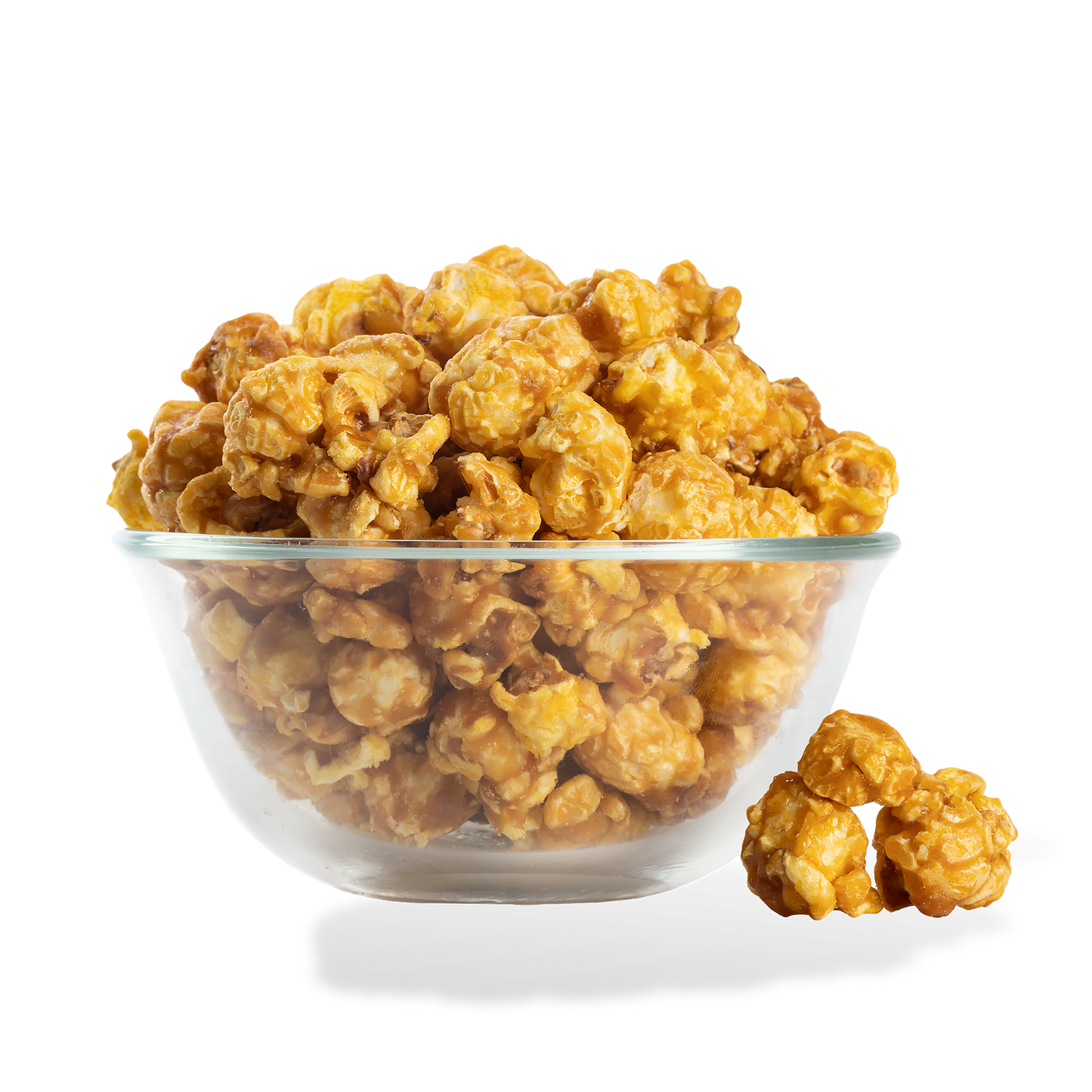 Extra Buttery Caramel Popcorn popped in a bowl on a white background