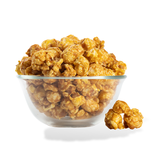 Extra Buttery Caramel Popcorn popped in a bowl on a white background