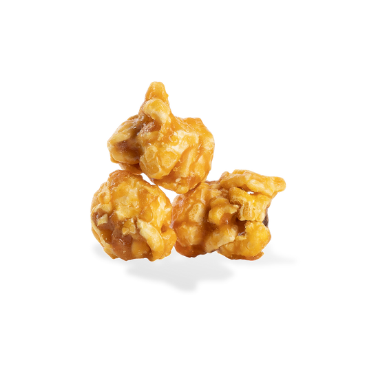 Three pieces of Extra Buttery Caramel popcorn on a white background