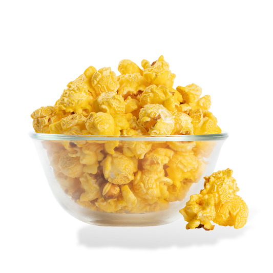 Extra Buttery Popcorn popped in a bowl on a white background