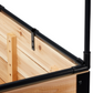 Close up of a wooden planter box with black greenhouse cover frame on a white background