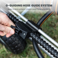 G-guiding hose guide system with a hand holding it on the Heavy Duty Garden Hose Reel cart sitting on a grassy background.