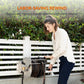 Woman using the ergonomic manual handle to rewind the heavy-duty wall-mounted stainless steel garden hose reel.  