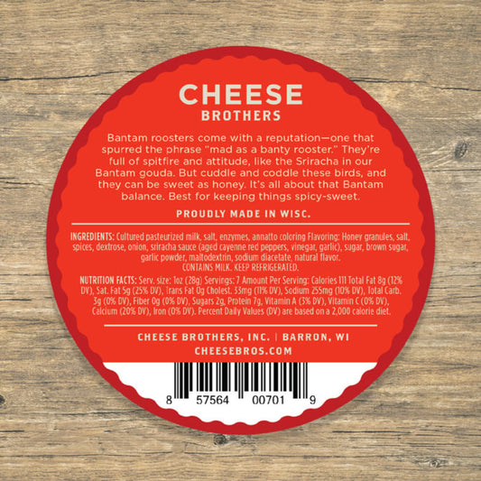 Honey Sriracha Cheese product label with ingredient list and nutrition facts presented on wooden background