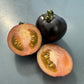 Ripened Indigo Rose Tomato sliced. Used to display tomato seeds for sale