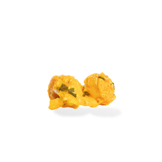Three pieces of Loaded Potato popcorn on a white background
