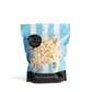 Bag of City Pop Low Salt popcorn with blue and white striped design on a white background