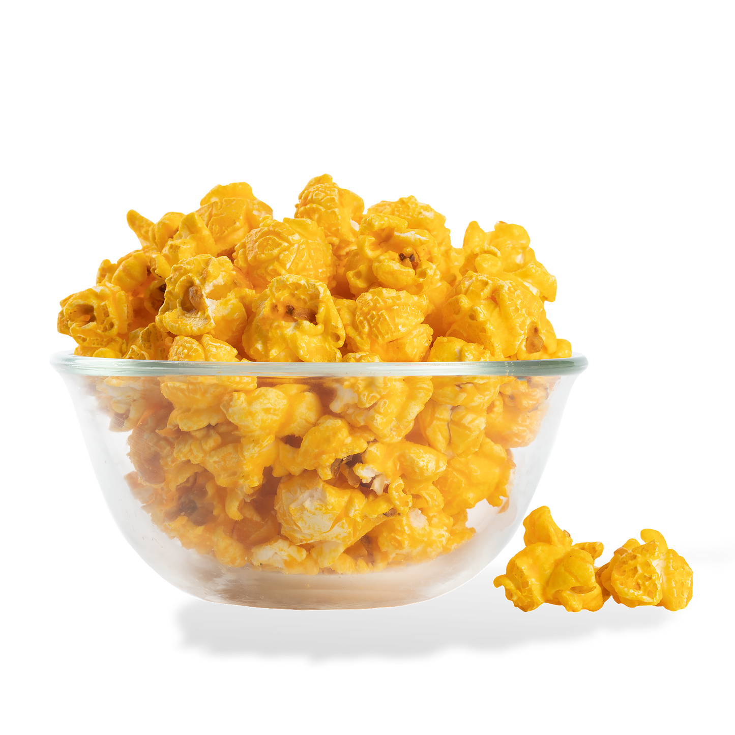 Mac and Cheese Popcorn popped in a bowl on a white background