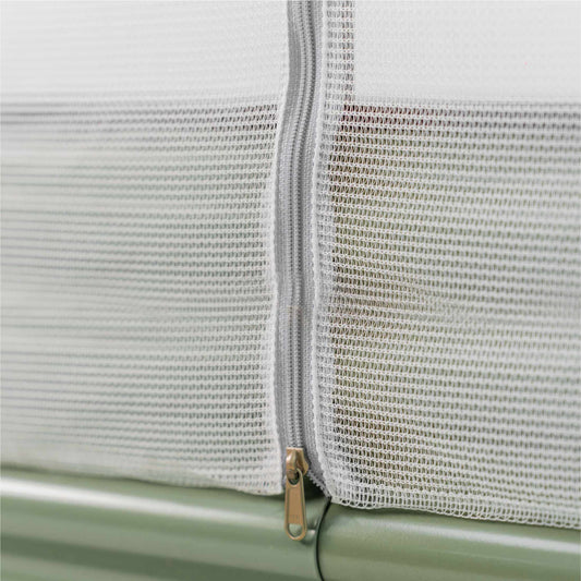 Close up image of the Mesh Cover System for Elevated Garden Beds installed on a green elevated garden bed.