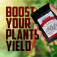 Hand holding a packet of 'Mighty Plant Instant Compost Tea' with text 'Boost Your Plants Yield' on a blurred green background.