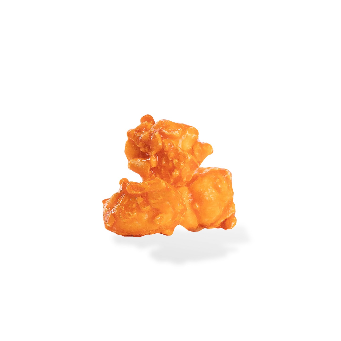 Three pieces of Orange popcorn on a white background