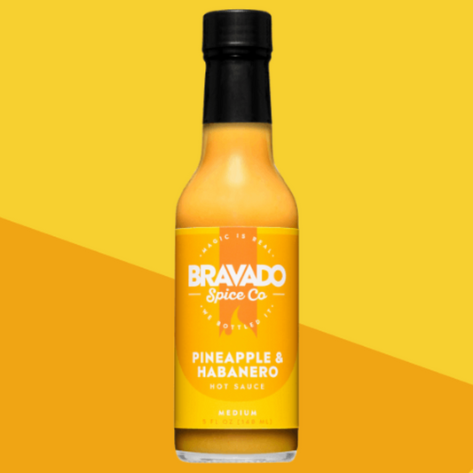 Bottle of Pineapple & Habanero hot sauce on a yellow background