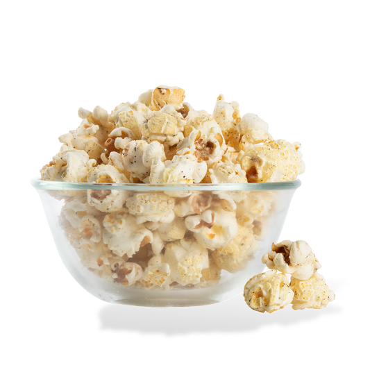 Sea Salt & Cracked Pepper Popcorn popped in a bowl on a white background